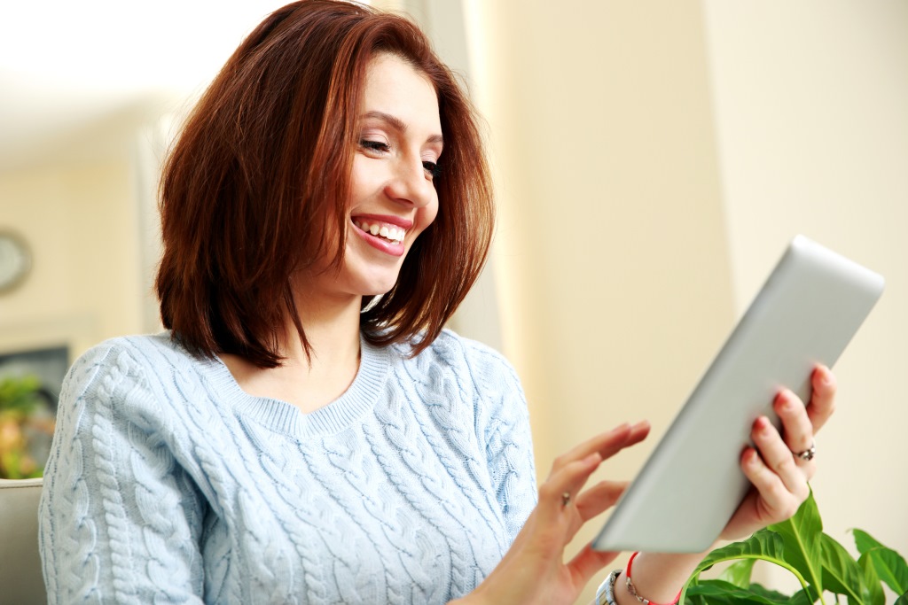 woman reading tablet